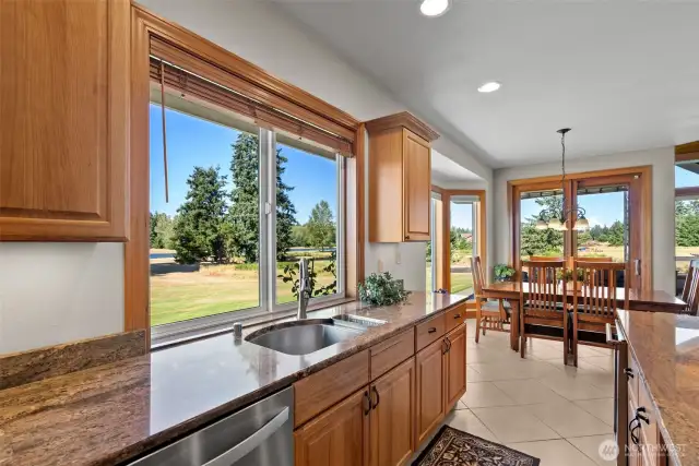 Kitchen flows into dining area with sliders that flow into the back patio.