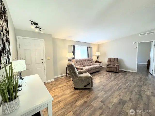 Living room w/new LVP flooring throughout entire house!