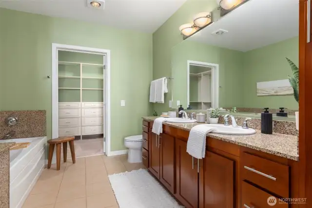 Double vanity, soaking tub and oversized walk-in with California closet built-ins.