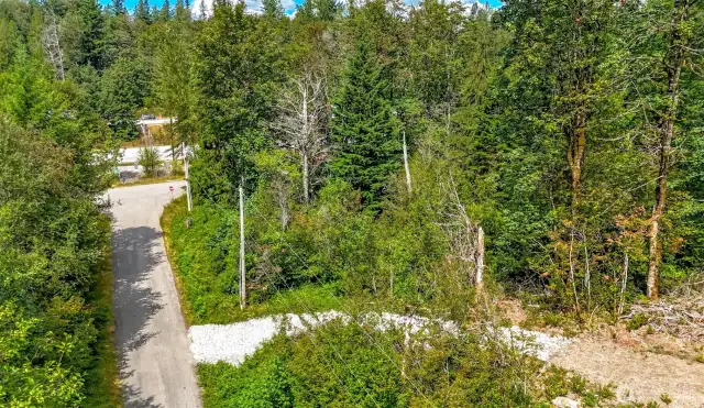 Ariel View of gravel drive way entering lot from street