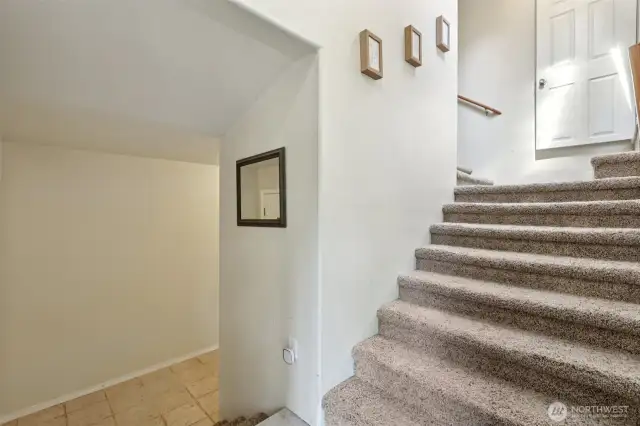 ADU: Stairs leads up to kitchen, dining, two bedrooms and playroom.
