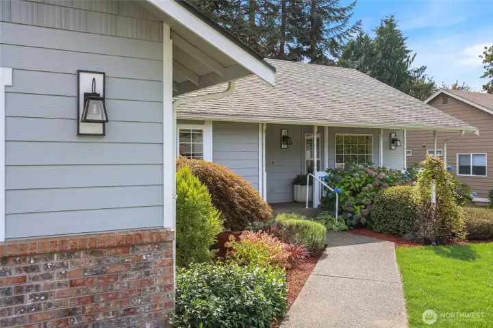 Drop by for a visit - you'll be greeted with a new lawn and rocking-chair front porch. Tidy and well-cared for exterior shines with pride.