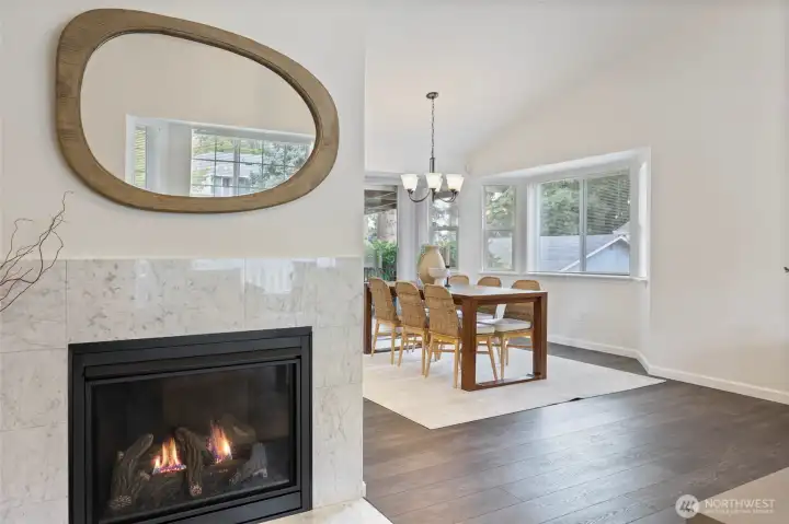 Custom Italian marble surround on this 2022 fireplace - warmth & beauty.