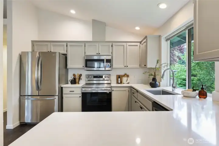 Purposeful kitchen space can accommodate a few cooks at a time - oodles of counter space and cabinets.