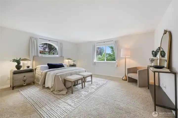 Large and bright primary suite also looks to the backyard.