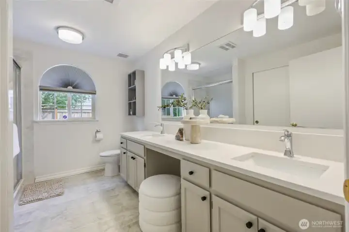 Updates in 2022 include new quartz counters & lighting. The low barrier shower features a cultured marble surround.