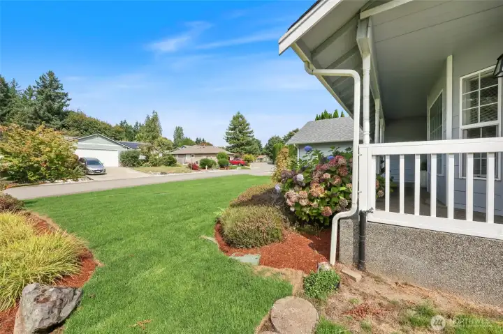 Outside? Beautiful front yard with established garden beds.