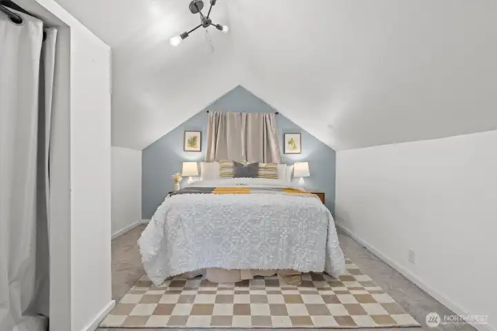 This is the start of your upstairs primary suite. Enjoy your private bedroom and when you need to change your space, head out the door.