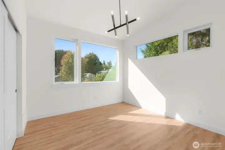 ADU bedroom with oversized window + natural light.
