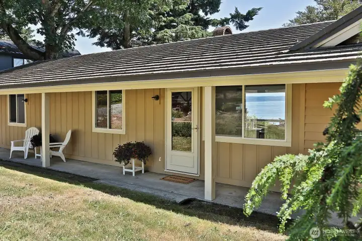 Covered front porch extends the north side of your home and provides a nice place to find shade on hot sunny days. Let's go inside....