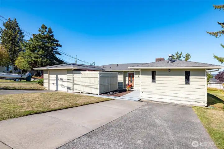 Front of the house with plenty of off street parking and a single car garage.