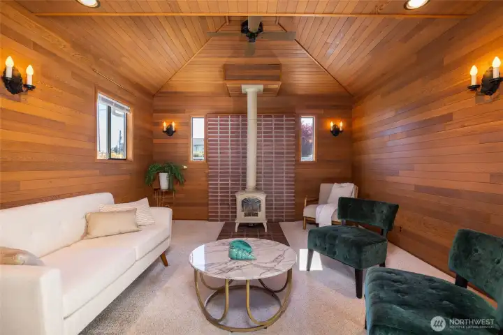 The bonus room has wood paneled walls and a gas fireplace to take the chill off on those chilly PNW evenings.