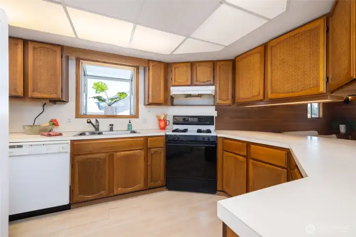The kitchen has plenty of storage/cabinet space and lots of counter space.