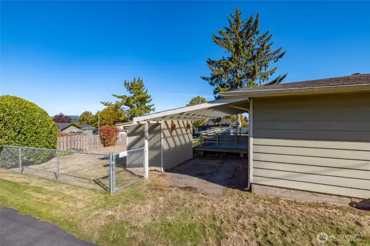 The extra carport and storage area behind the house.