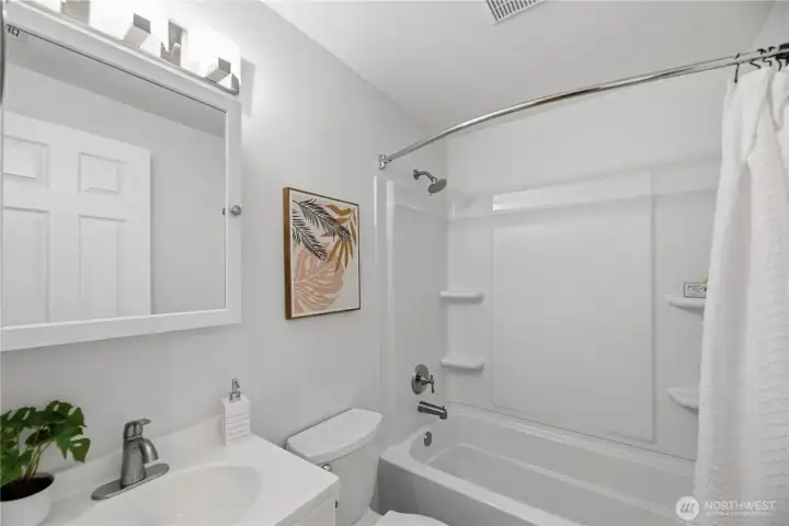 New tub/shower surround has been installed, offering a fresh, clean look with updated finishes and easy-care surfaces—perfectly blending style and functionality for everyday comfort.