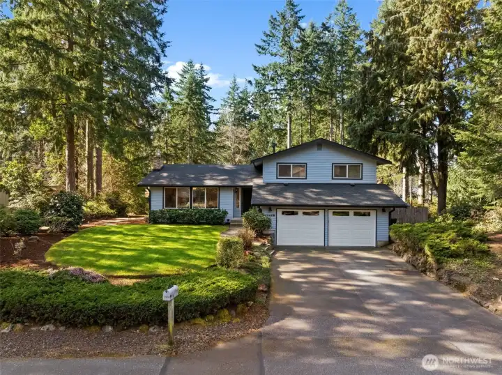 Large Open Lot and perfectly matured landscaping! Bonus - enjoy this home's two-car attached garage with an extra four parking spaces outside of the home! Potential RV parking on the right side of the home!