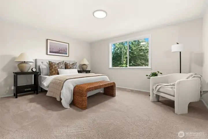 Sophistication meets serenity. The primary bedroom offers an expansive, airy footprint that leverages natural light to create an atmosphere of quiet, understated tranquility.