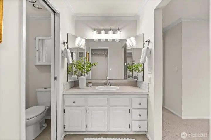 By incorporating the en-suite directly into the primary footprint, the design prioritizes ease of movement and a luxurious, 'all-access' feel to the home’s private amenities.