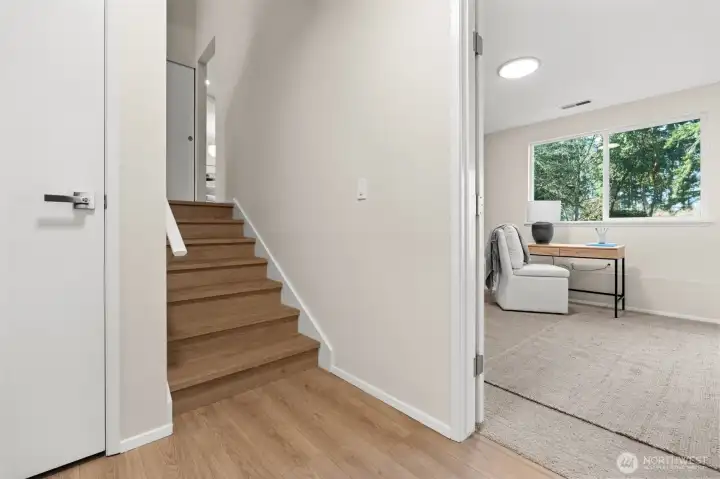 The ultimate multi-functional living suite. This lower level serves as a seamless bridge between the oversized garage and the outdoor deck, offering a relaxed, high-utility space that’s perfect for indoor-outdoor entertaining.