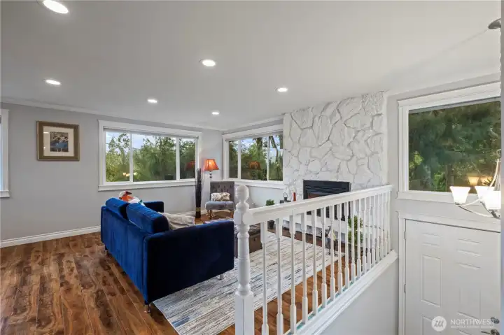 open living room with western facing wall of windows