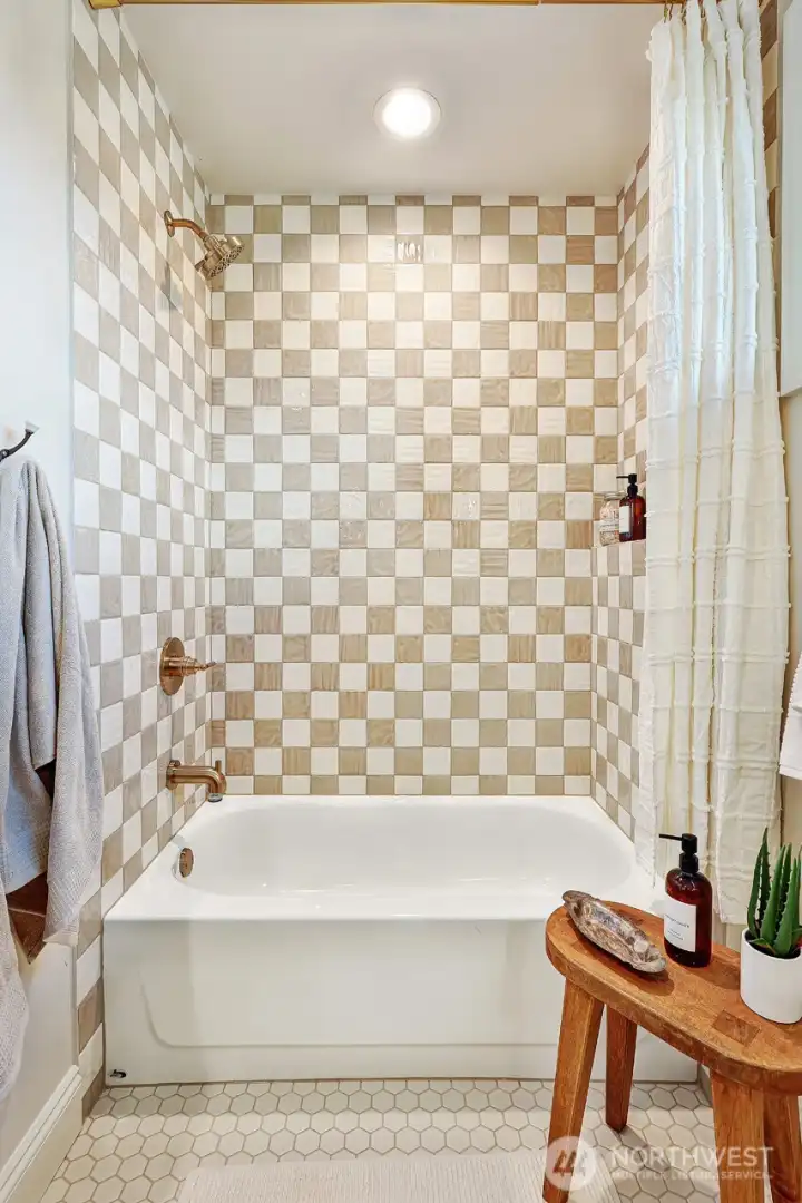 Radiant heated floors and custom tilework add comfort and style to every bathroom.