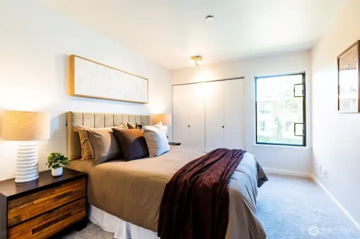 The second bedroom and full bath offer comfort for guests or a home office.