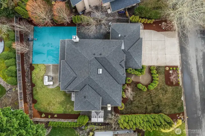 A bird's-eye view highlights the home's new roof, three-car garage, and generous lot with beautifully maintained landscaping, showcasing the full scope of this exceptional Trossachs property.