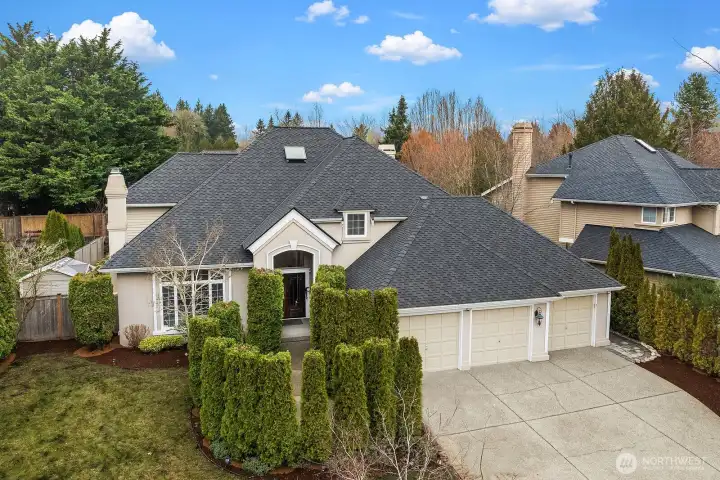 Timeless curb appeal is on full display with a new roof, classic stone and stucco facade, three-car garage, and manicured landscaping, a picture-perfect welcome to this exceptional Trossachs home.