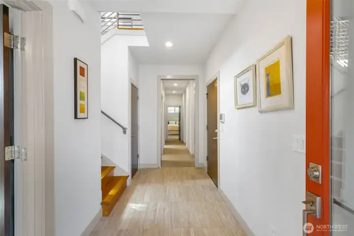 This view from the front door entry leads to the very private sleeping quarters, partitioned by a pocket door straight ahead. Bedroom, or office, directly to your left.