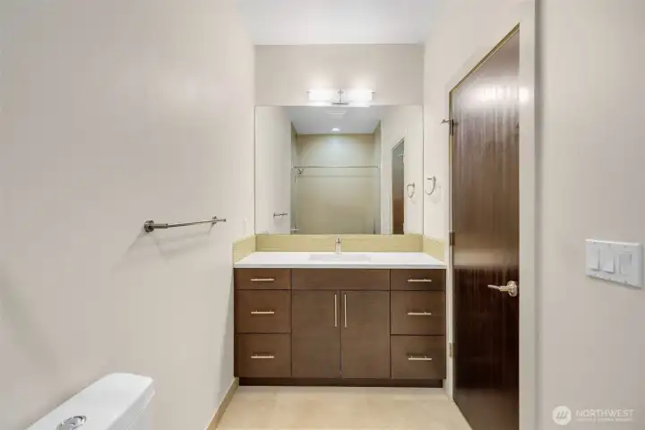 Full hall bath in the sleeping quarters on the lower level.