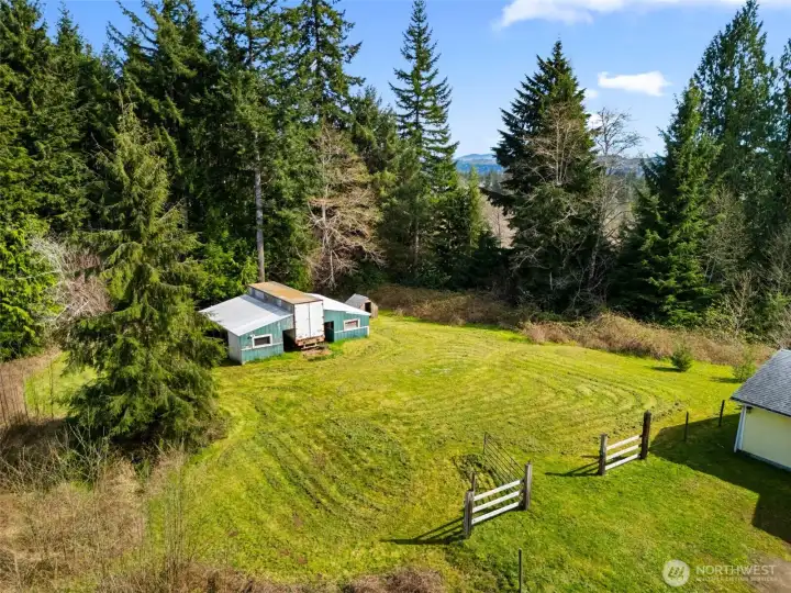 The barn is ready for your horses or animals. There is trail access behind the barn as well.