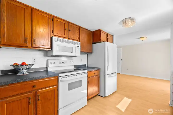 The kitchen opens to the dining room and has easy access to the patio and deck.