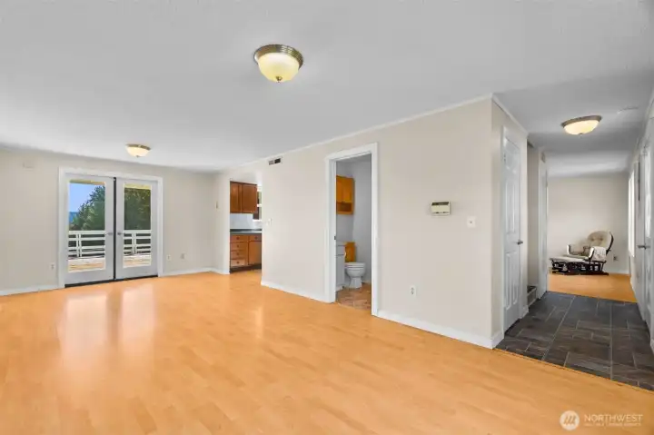 The dining room features french doors that open to the deck and patio. 1/2 bathroom and very large walk-in closet off the front door.