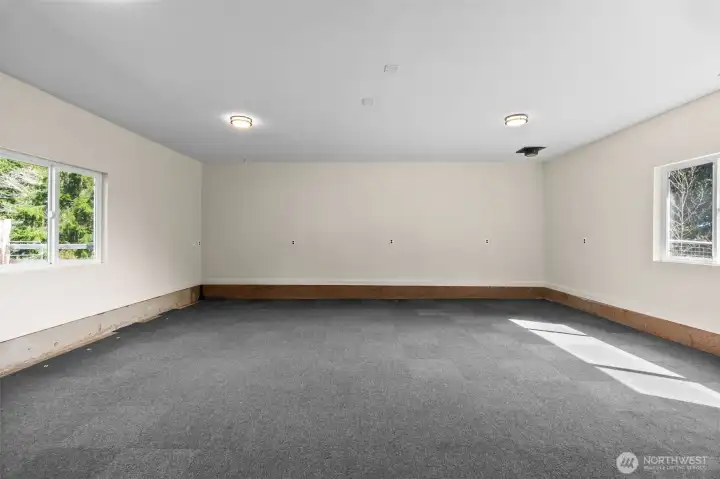 Very large rec room is ready for your vision and design! New paint and ample natural light.