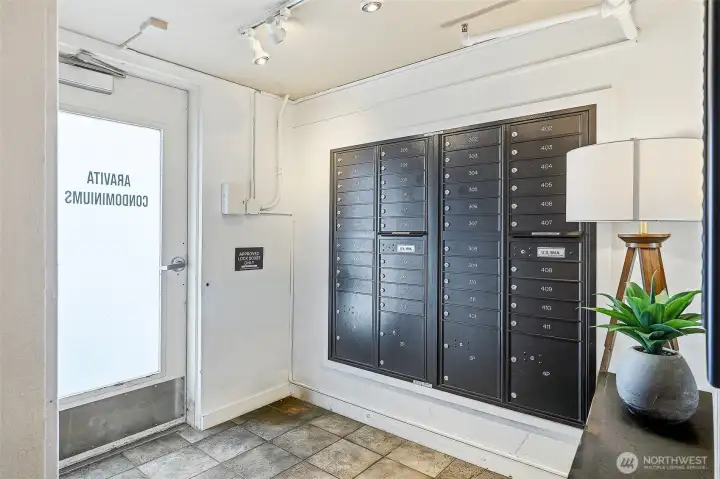 Secure, locked entry with mailboxes as you enter the front door
