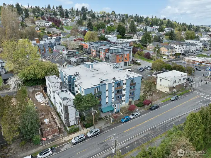 Aerial view looking NW of the building and surrounding neighborhood with ample street parking