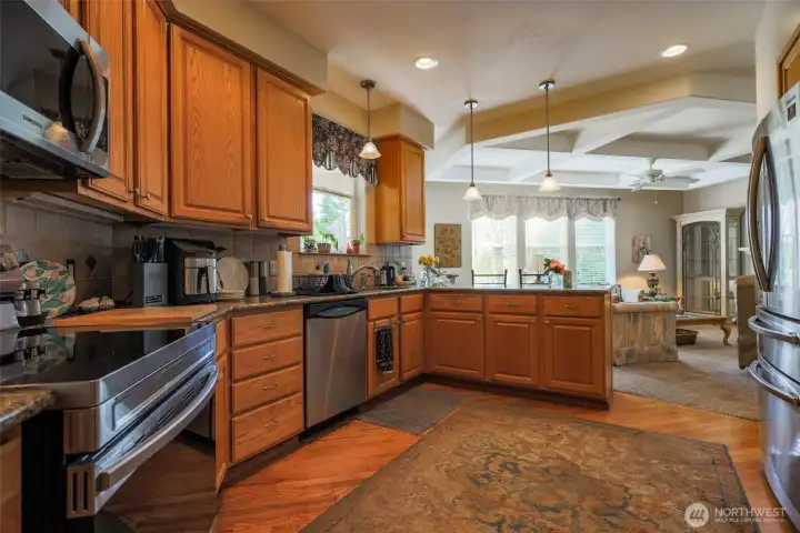 Granite Counter tops w/ bar. Open to Family Room