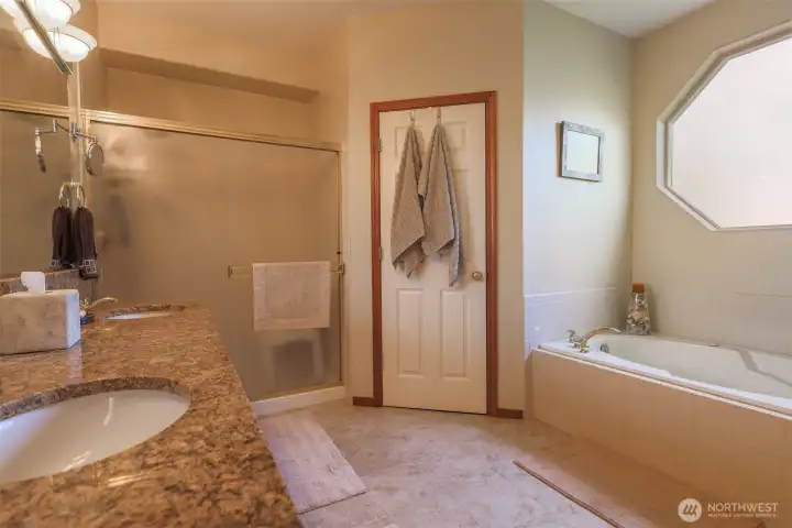 Large Primary on suite Bath. Large walk in shower, jetted tub plus his and hers walk-in closets.