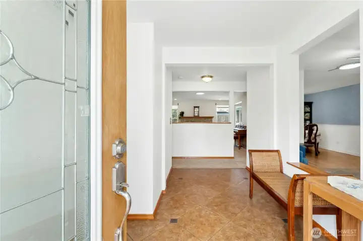 Covered porch converted to large entry way