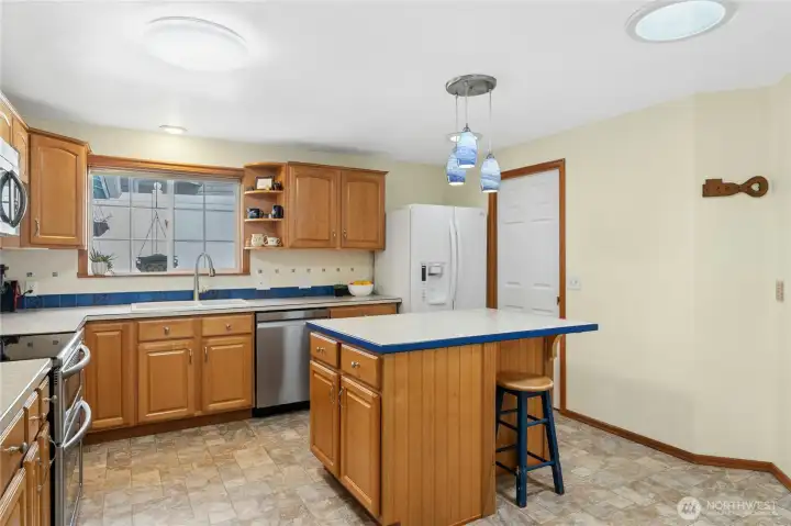 Kitchen pantry leads through to laundry/ utility room.