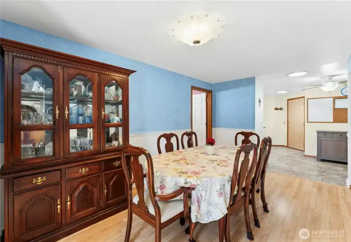 Formal dining room off kitchen opens to bonus room.