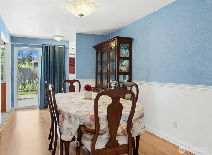 Formal dining room leads through to primary suite.