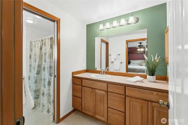 Primary en Suite leads through to shower/tub room and into second walk in closet entrance.