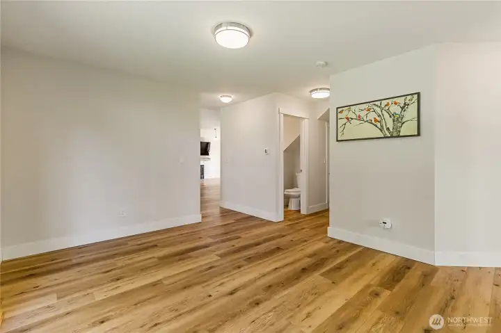Extra living space on main leading to 1/2 bath and laundry