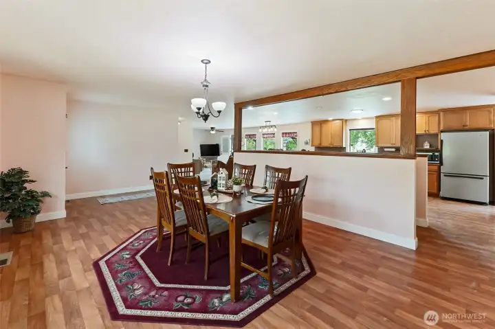 open dining and kitchen with staircase to lower level