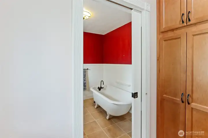 bathroom off of kitchen with pocket door