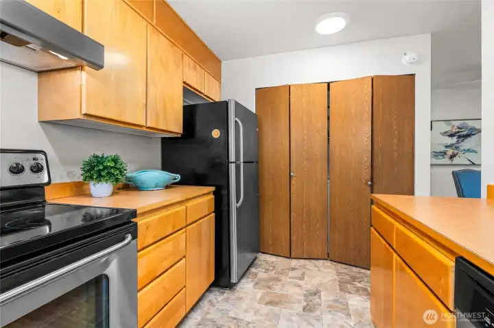 Kitchen and behind the doors are the washer and dryer.