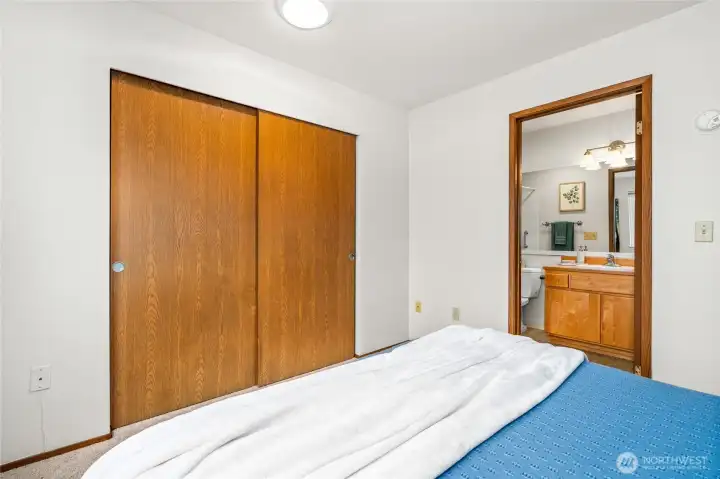 Primary suite is relaxing with large closet and private bathroom.