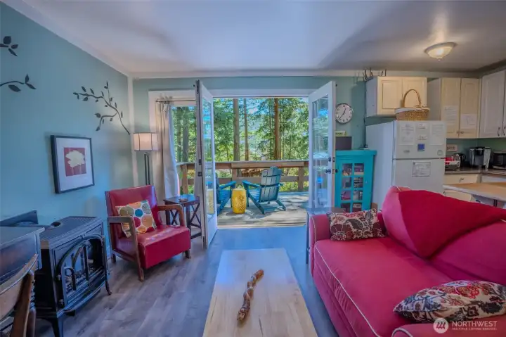 French doors lead to a relaxing deck. French doors lead to a relaxing deck.