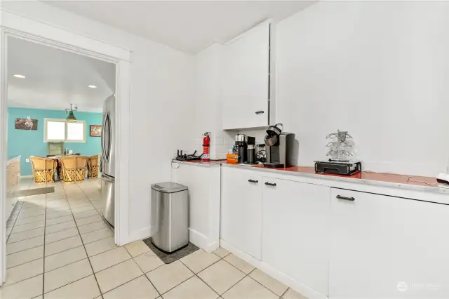 utility room is located on the otherside of the kitchen